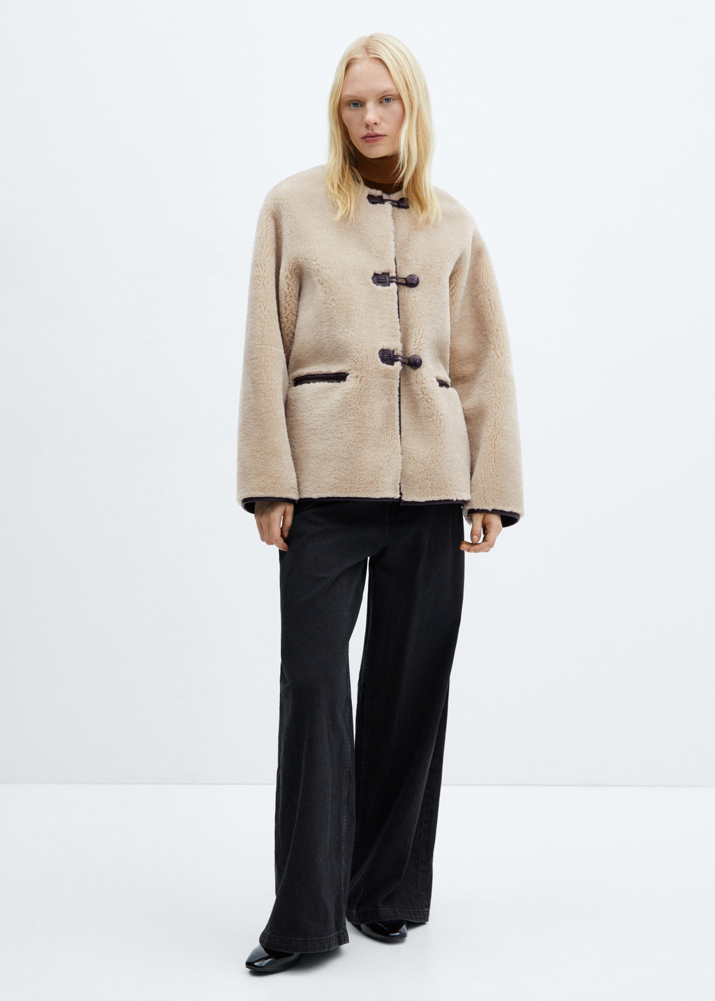 Faux fur coat with applications