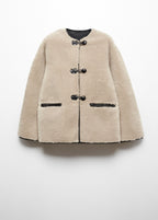 Faux fur coat with applications
